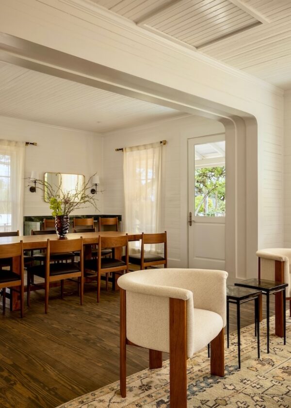 Cozy dining room with wooden table and chairs beige armchairs and natural light