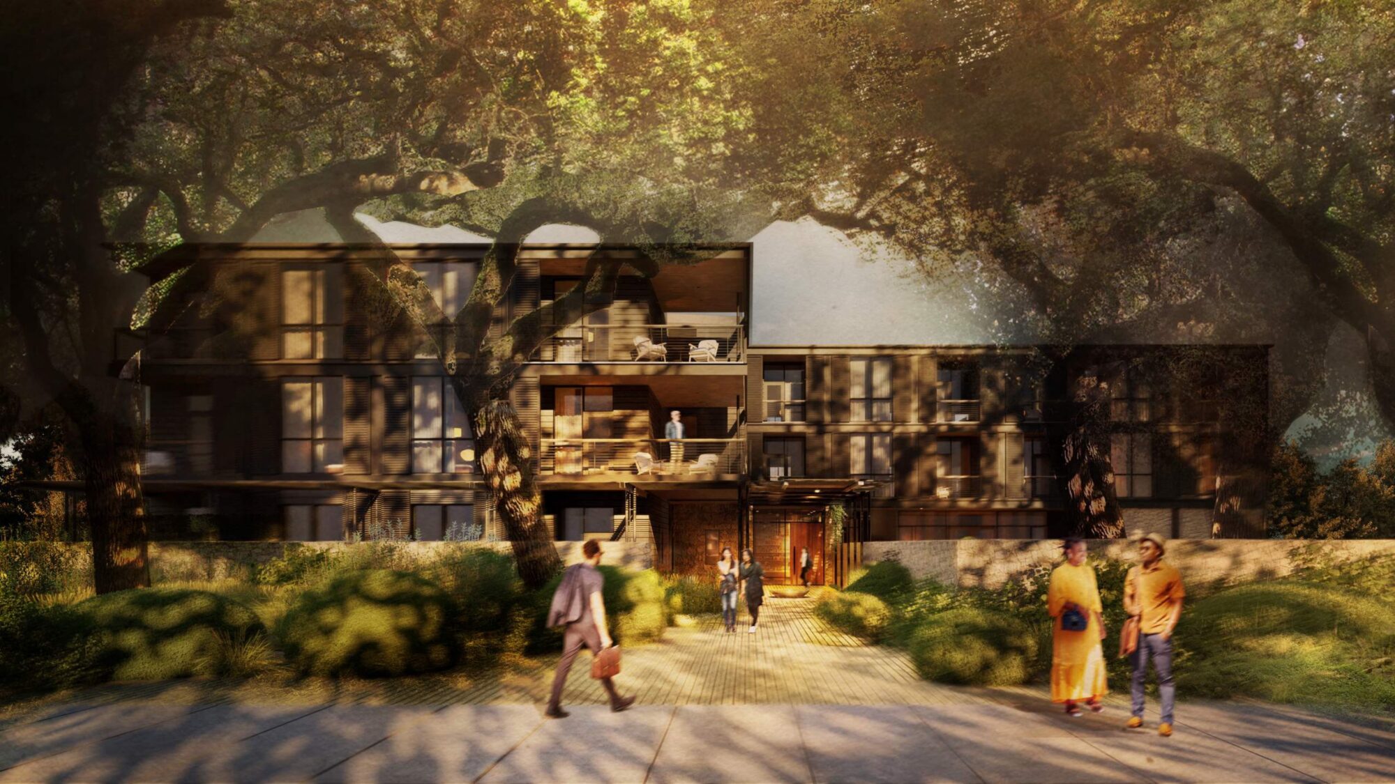 Modern building facade with people walking under large trees in soft, warm sunlight