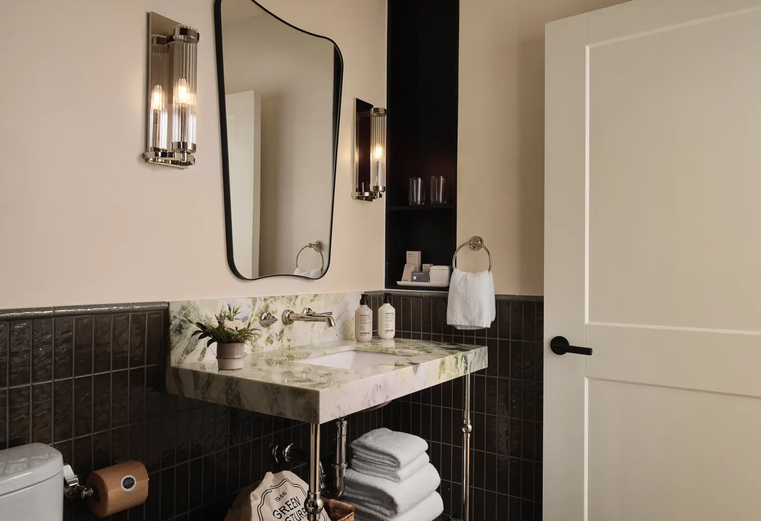 Modern bathroom with marble sink and stylish mirror lighting