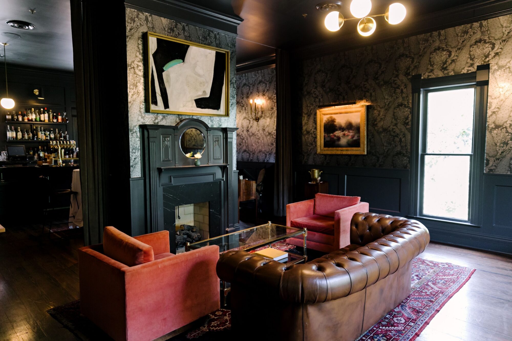 Stylish living room with vintage decor leather sofa bar and artwork